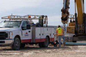 Utility crews installing water lines