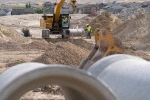 Sunroc Utility Crews installing storm drain and sewer pipe